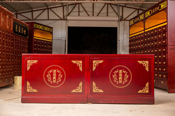 What kind of wood is commonly used for traditional Chinese medicine cabinets?